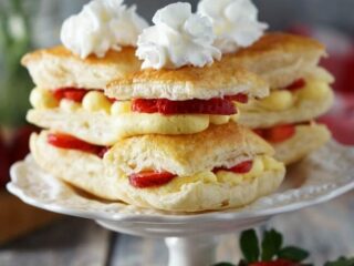 Light and fresh, but oh so indulgent, strawberry napoleons start with flaky puff pastry layered with fresh strawberries and Bavarian cream, topped off with a perfect swirl of whipped cream. Ready in 30 minutes. Recipe on www.accidentalhappybaker.com @AHBamy