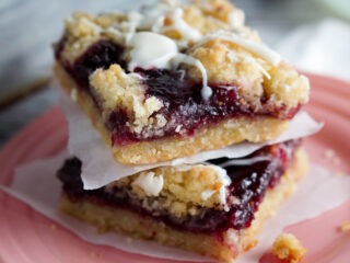 Two Raspberry White Chocolate Shortbread bars sitting on a plate
